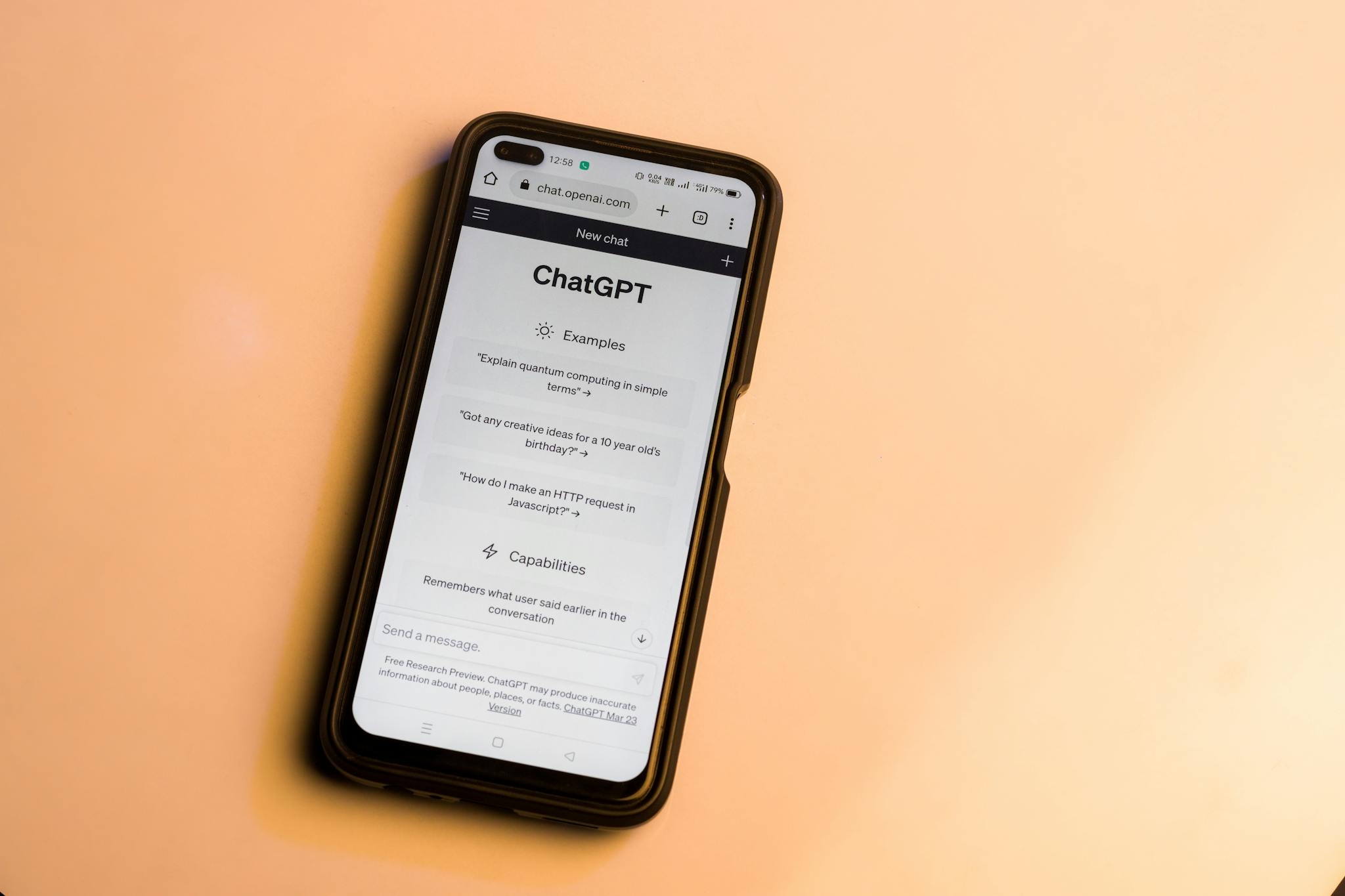 Home 7 smartphone showing chatgpt website with warm tone